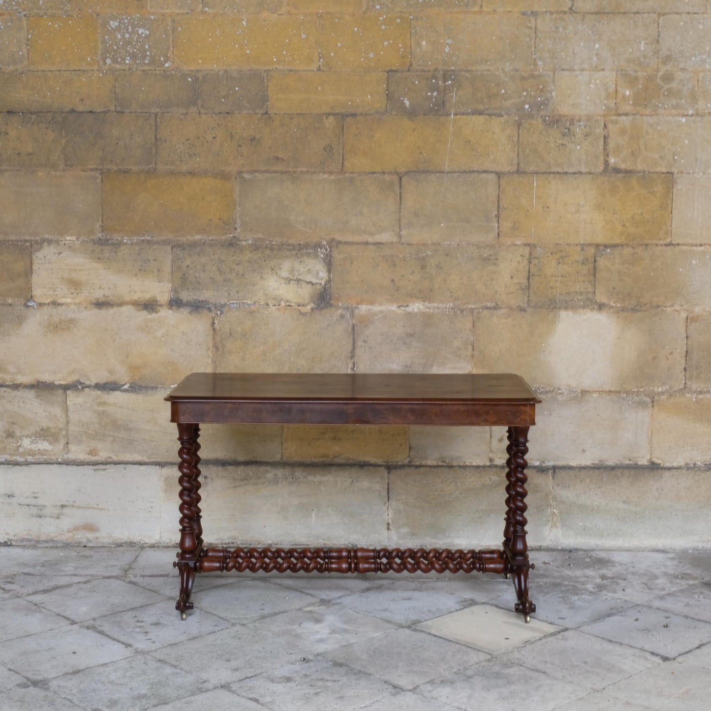 A VICTORIAN WALNUT AND ROSEWOOD LIBRARY TABLE