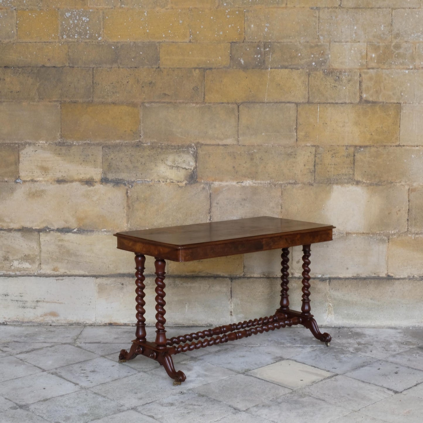 A VICTORIAN WALNUT AND ROSEWOOD LIBRARY TABLE