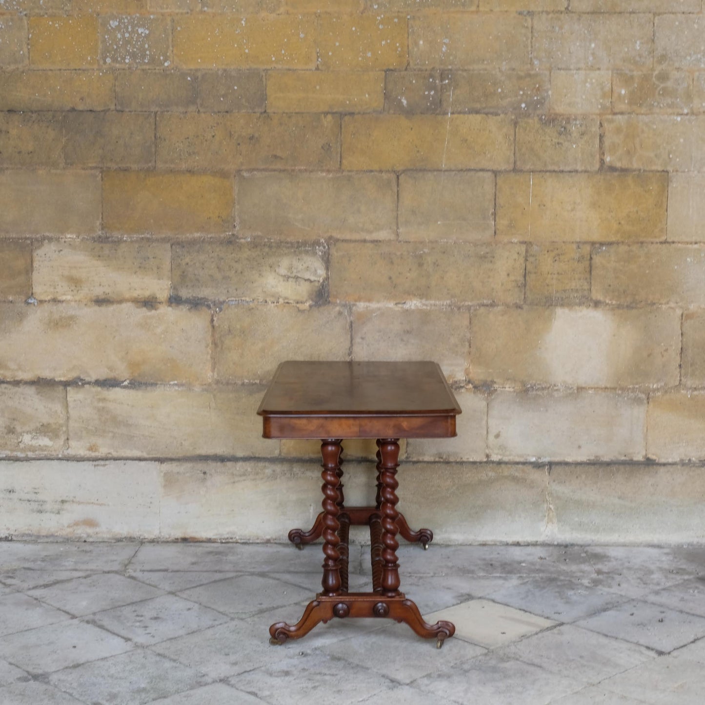 A VICTORIAN WALNUT AND ROSEWOOD LIBRARY TABLE