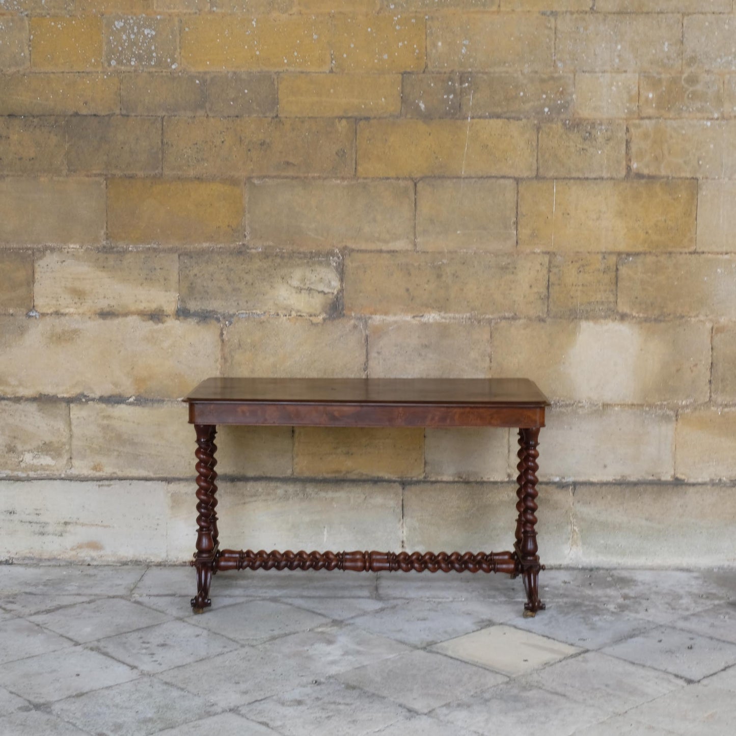 A VICTORIAN WALNUT AND ROSEWOOD LIBRARY TABLE