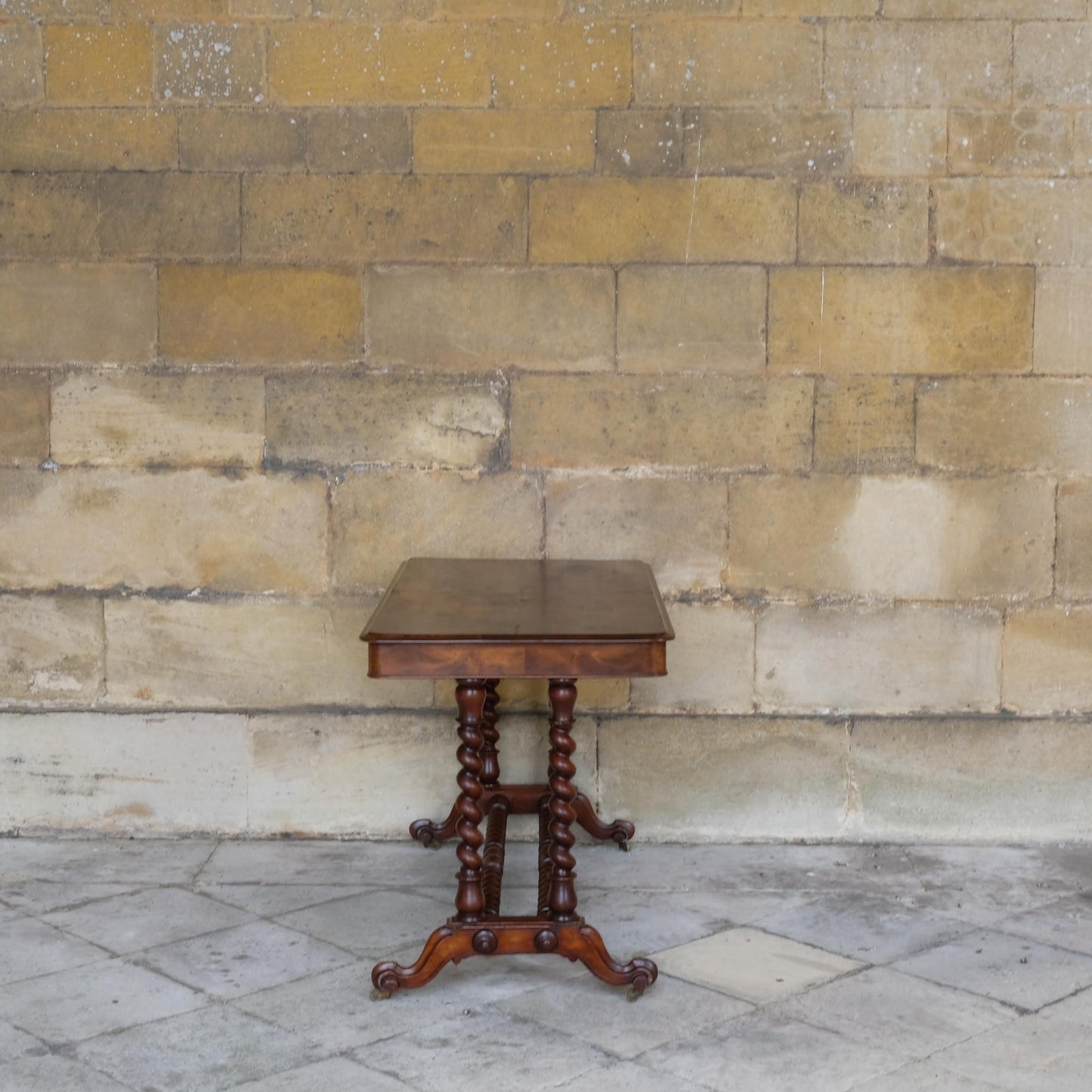 A VICTORIAN WALNUT AND ROSEWOOD LIBRARY TABLE