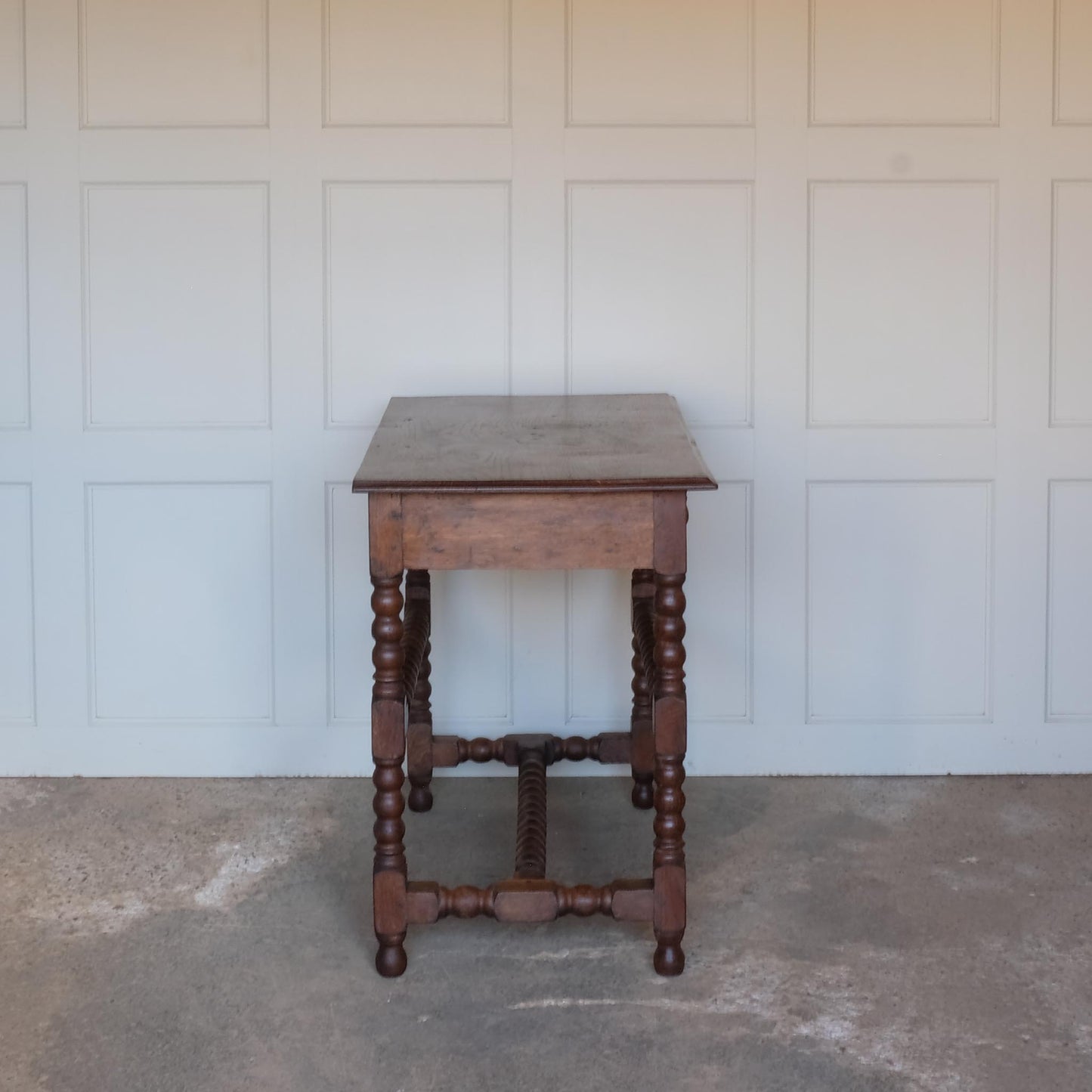 Side view of 19th Century Antique Oak Bobbin Side Table by Summerfield & Scott