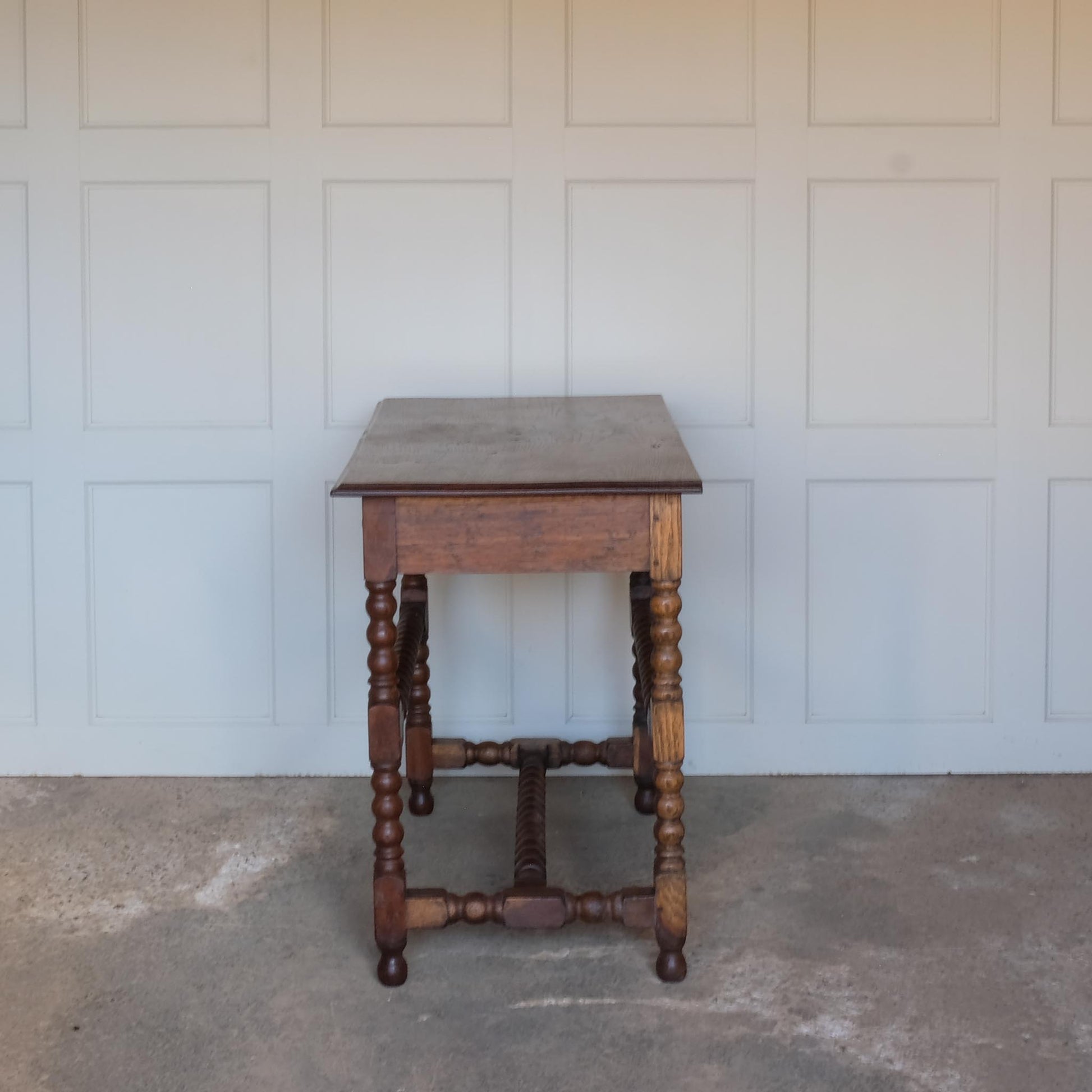 Left hand side view of 19th Century Antique Oak Bobbin Side Table by Summerfield & Scott