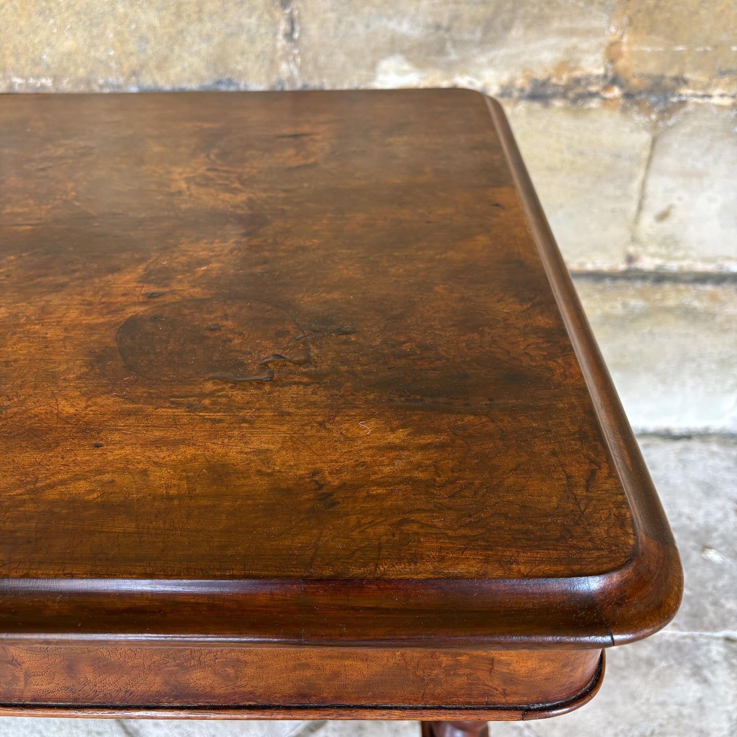 A VICTORIAN WALNUT AND ROSEWOOD LIBRARY TABLE