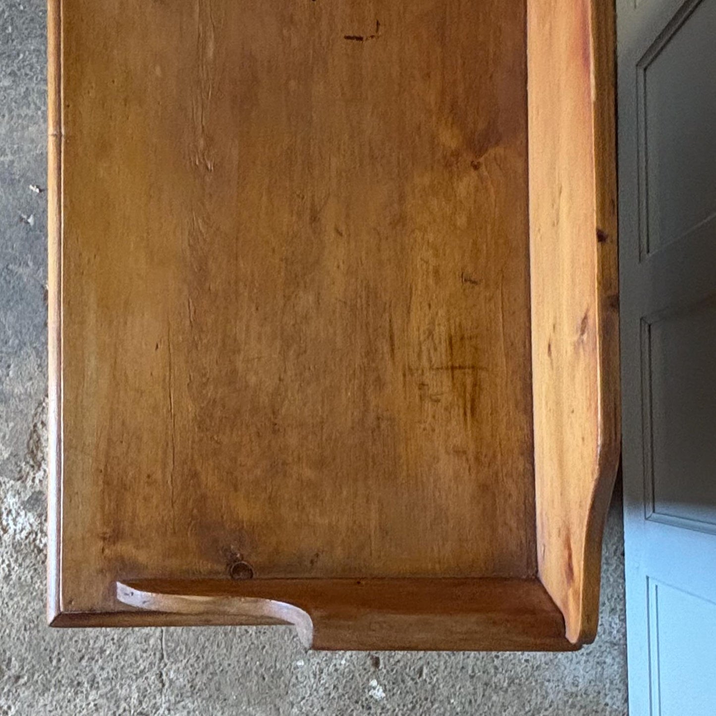 An Edwardian pine chest of drawers with 3/4 galleried top, with two short over two long drawers, raised on turned bun feet. Some gentle patina as to be expected, the drawers all working smoothly, in very good condition.